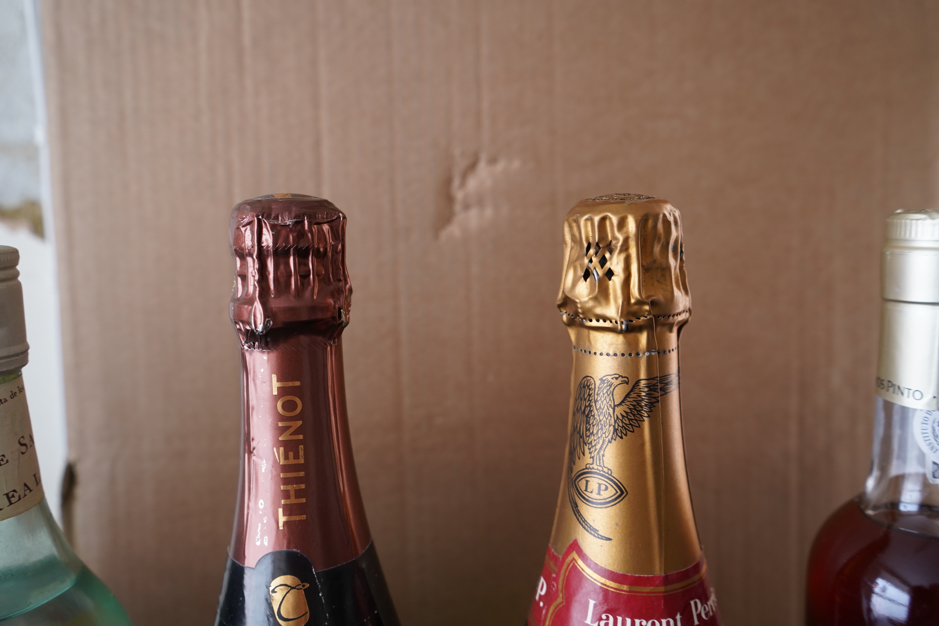 Eight bottles of champagne, port and rum to include Mumm, Laurent Perrier and Warres